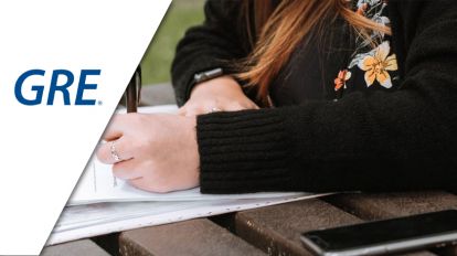 A woman writing on a paper