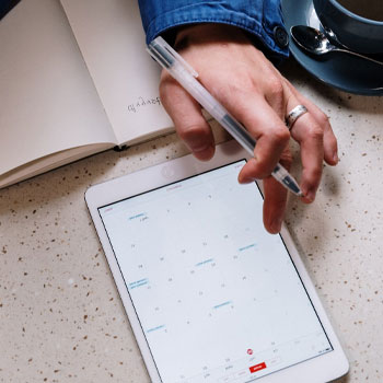 A man checking what to bring to the MCAT on his tablet