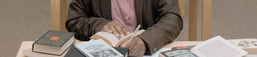 A man studying inside a library