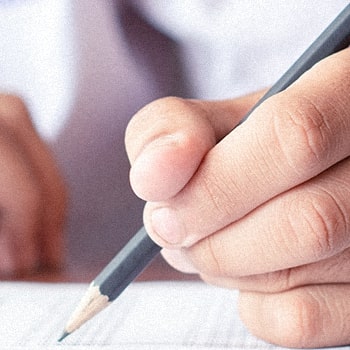 A student writing an answer for the xam
