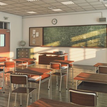 Classroom with brown chairs and tables during the afternoon
