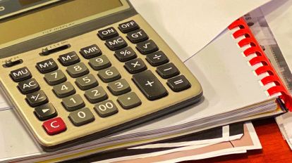 Calculator on a stacked documents