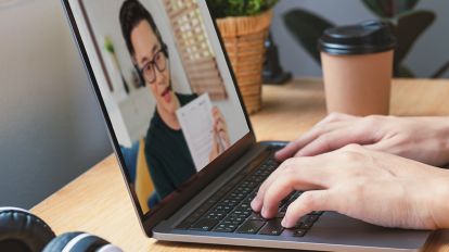A person talking to an instructor in a virtual meeting