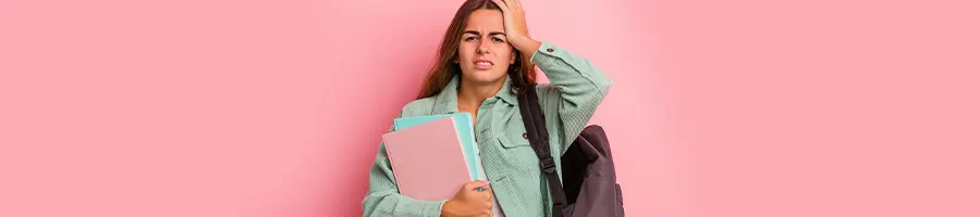 female student holding her head in frustration