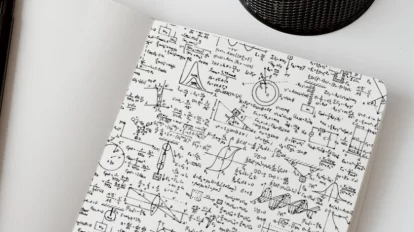 Random physics equations written on a notebook