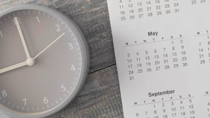 Clock and calendar on wooden floor