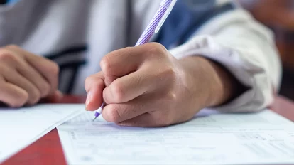 A student in class taking an examination