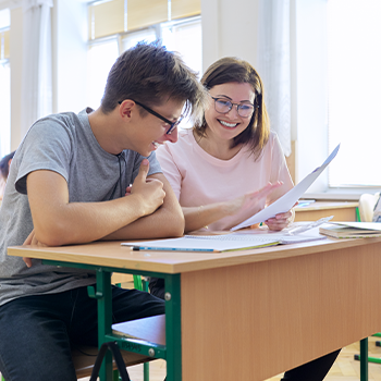 student and teacher working together