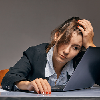 stressed out woman doing work