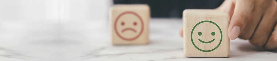 hand view of a person showing a small block of smiley face