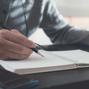Writing notes on a notebook