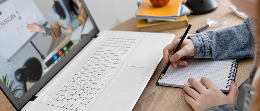 Student studying in front of online meeting